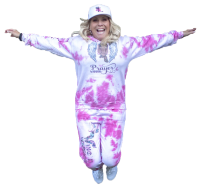 Wing'd Warrior jumping in tie dyed sweatsuuit